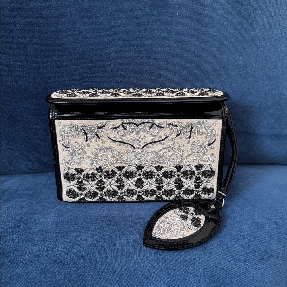 Donald J. Pliner Black and White Embroidered Wristlet Clutch